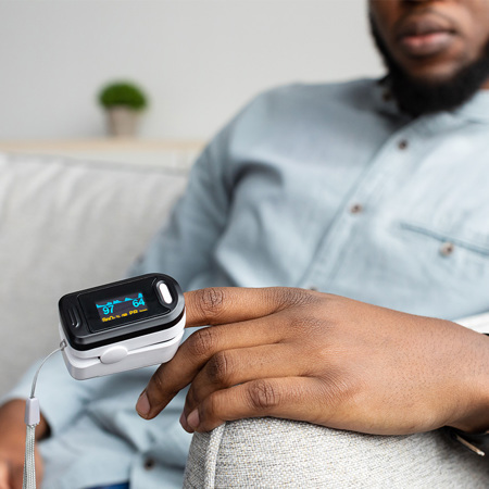Man with Pulse Oximeter